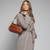 Leather crossbody bag with front zip and flap closure | The Bridge