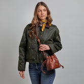 Mini leather bucket bag with shoulder strap | The Bridge
